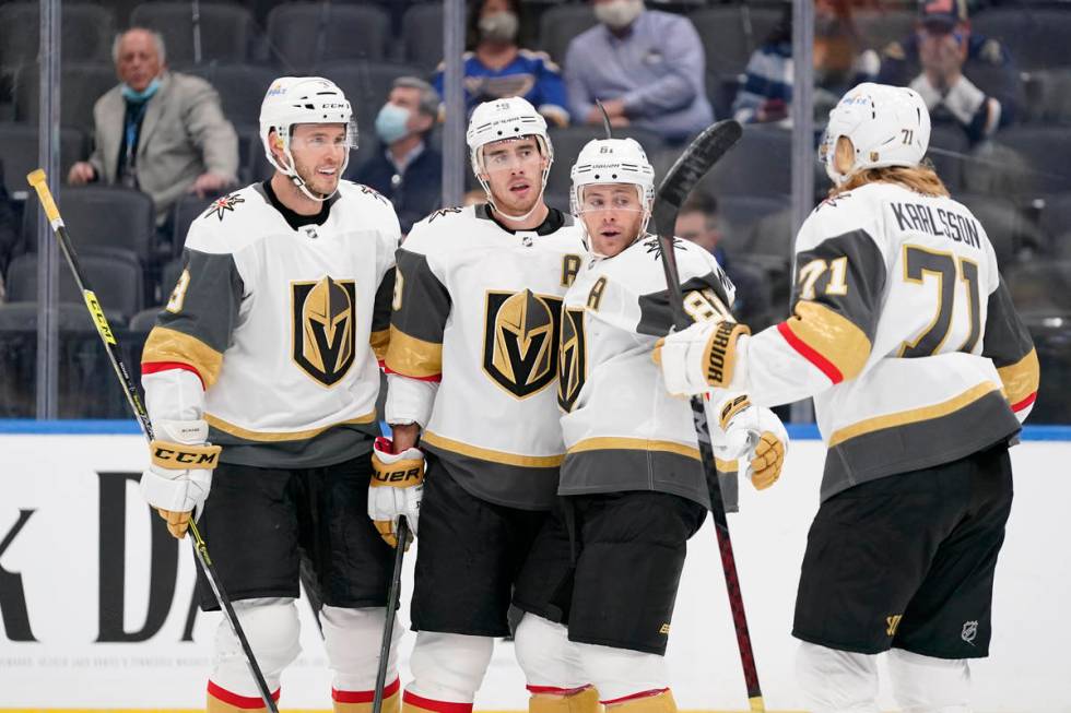 Vegas Golden Knights' Jonathan Marchessault (81) is congratulated by teammates Brayden McNabb, ...