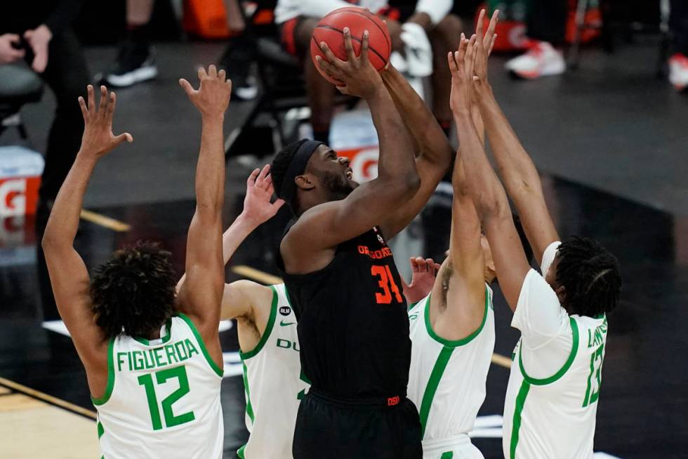 Oregon State's Rodrigue Andela (34) shoots against Oregon during the second half of an NCAA col ...