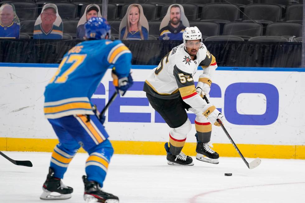 Vegas Golden Knights' Keegan Kolesar (55) handles the puck as St. Louis Blues' Torey Krug defen ...