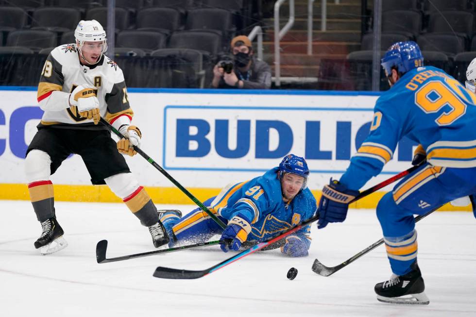 Vegas Golden Knights' Reilly Smith (19) watches as St. Louis Blues' Vladimir Tarasenko (91) and ...