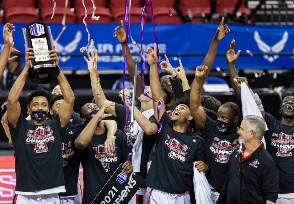 San Diego State Aztec players celebrates after winning the Mountain West conference men's colle ...