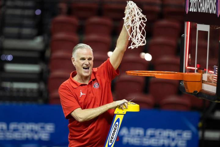 San Diego State Aztecs head coach Brian Dutcher celebrates after winning the Mountain West conf ...