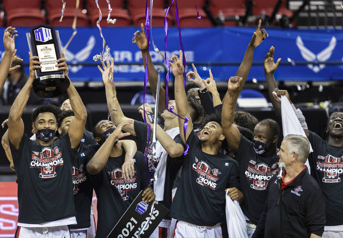 San Diego State Aztec players celebrates after winning the Mountain West conference men's colle ...