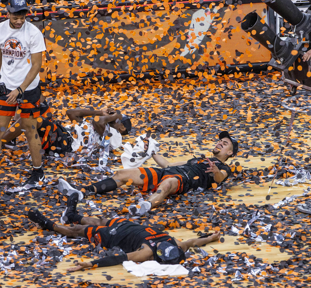 Oregon State Beavers players celebrate their win with confetti after defeating the Colorado Buf ...