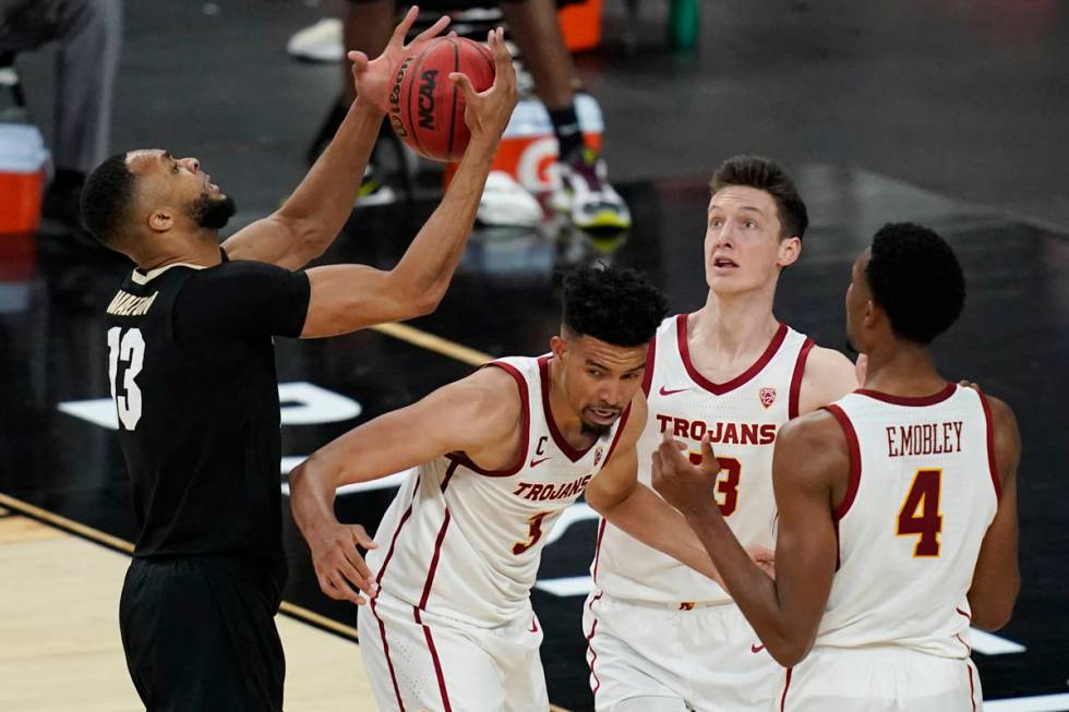 Colorado's Dallas Walton, left, grabs a rebound over Southern California's Isaiah Mobley (3), D ...