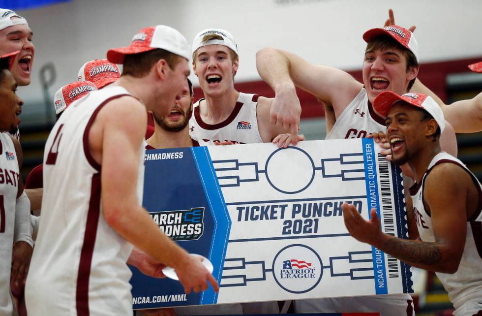 Colgate players celebrate beating Loyola (Md.), in an NCAA college basketball game in the final ...