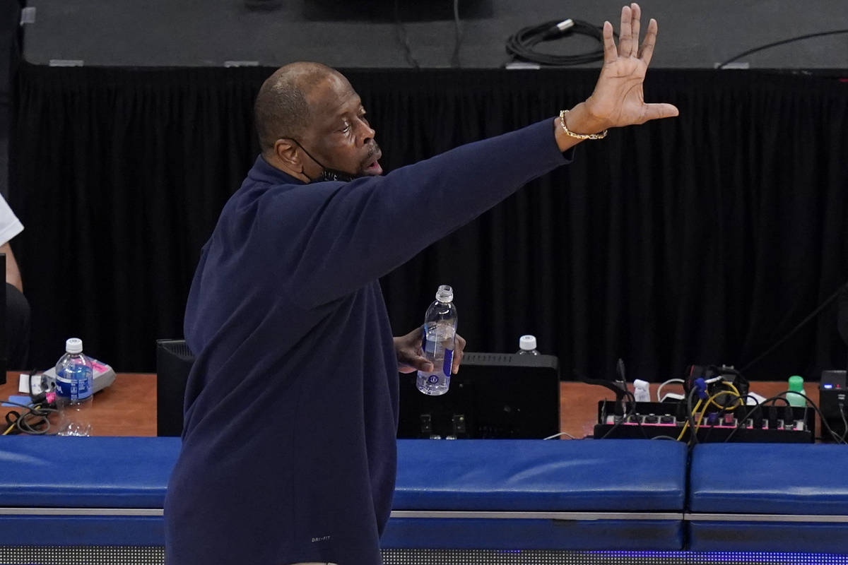 Georgetown coach Patrick Ewing calls out to players during the second half of the team's NCAA c ...