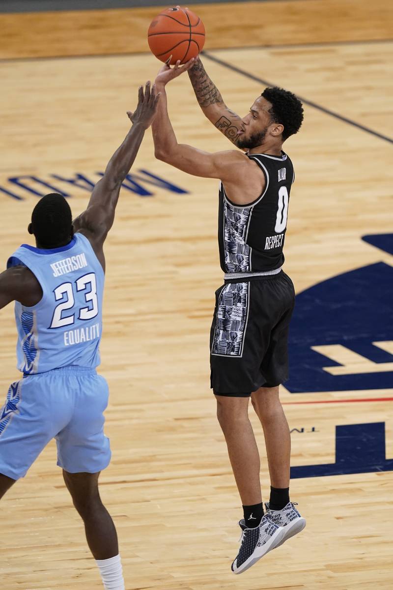 Georgetown's Jahvon Blair (0) shoots over Creighton's Damien Jefferson (23) during the first ha ...