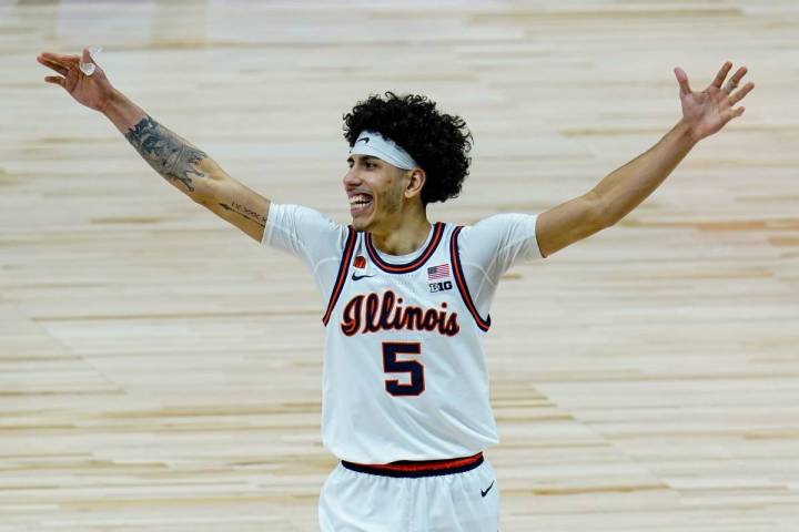 Illinois guard Andre Curbelo (5) celebrates after defeating Ohio State 91-88 in overtime in a N ...