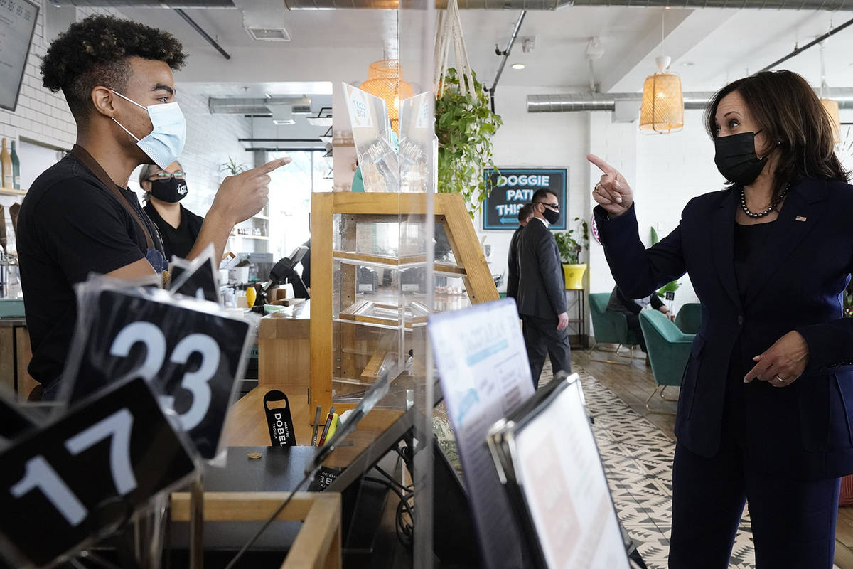 Vice President Kamala Harris gives her order to Germaine Turnbow, while stopping for lunch at T ...