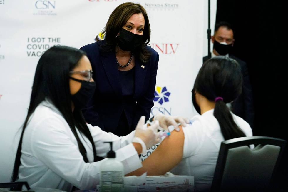 Vice President Kamala Harris looks over a vaccination site at the University of Nevada in Las V ...