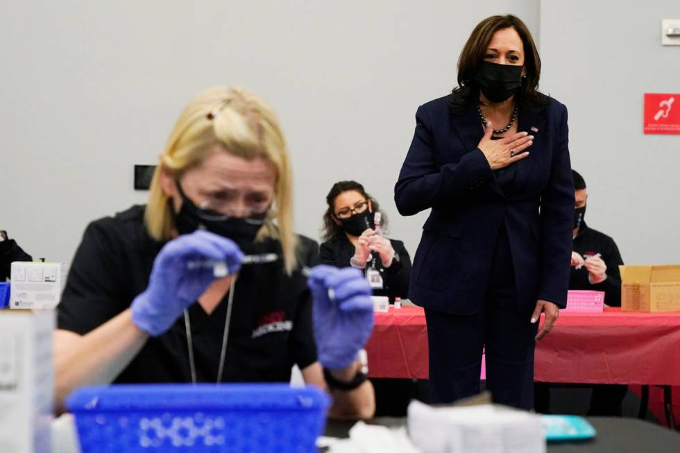 Vice President Kamala Harris looks over a vaccination site at the University of Nevada in Las V ...