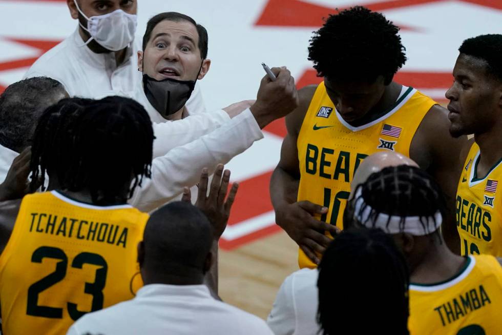 Baylor head coach Scott Drew talks to his team during the second half of an NCAA college basket ...
