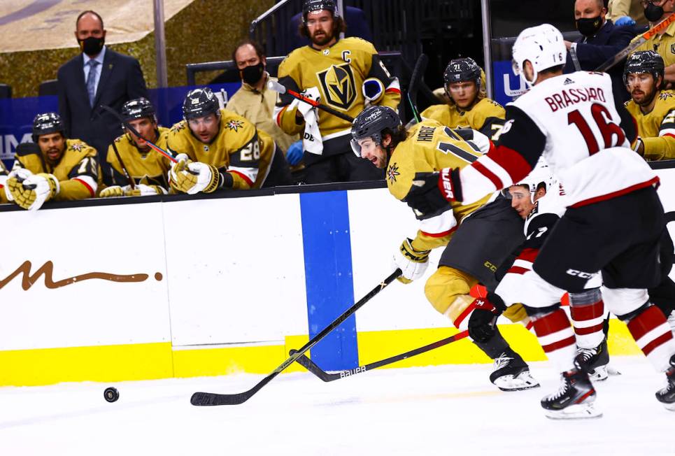 Golden Knights defenseman Nicolas Hague (14) skates with the puck during the second period of a ...