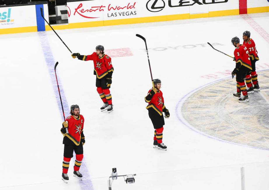 The Golden Knights celebrate after defeating the San Jose Sharks 2-1 in an NHL hockey game at T ...