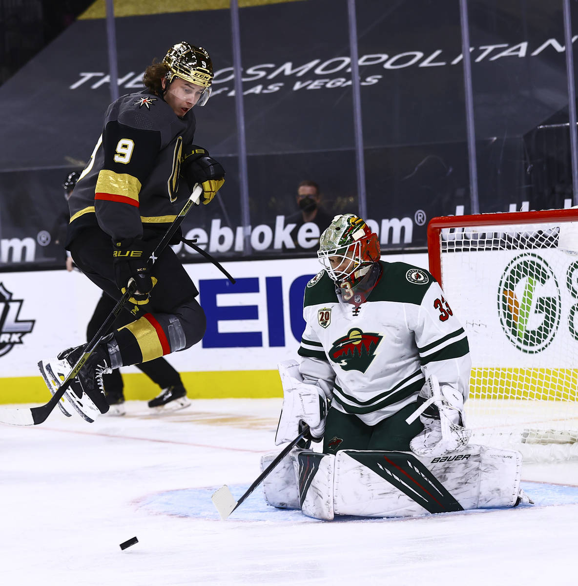 Golden Knights center Cody Glass (9) jumps out of the way as Minnesota Wild goaltender Cam Talb ...