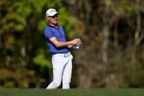 Justin Thomas watches his shot on the 14th hole during the final round of The Players Champions ...