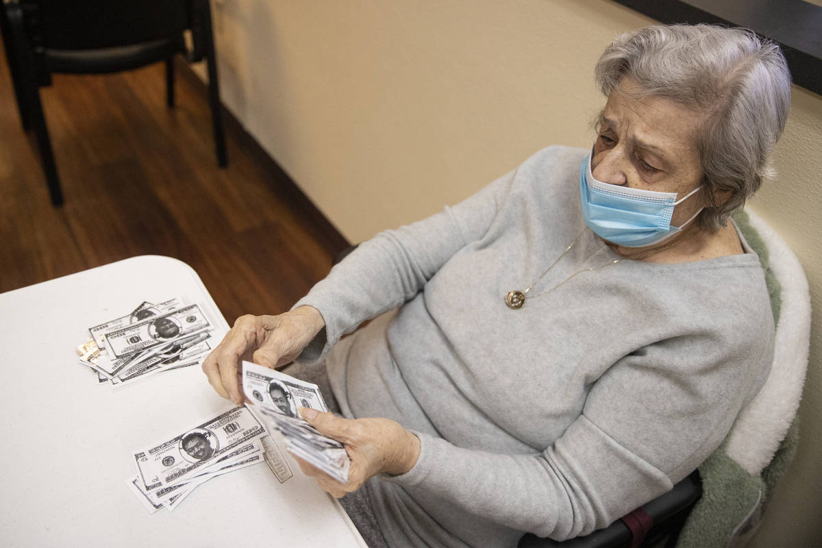 Grace Fagone, 83, counts bingo money at the Nevada Adult Daycare Health Center in Las Vegas, on ...