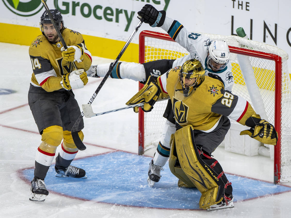 Golden Knights goaltender Marc-Andre Fleury (29) keeps his position as San Jose Sharks left win ...