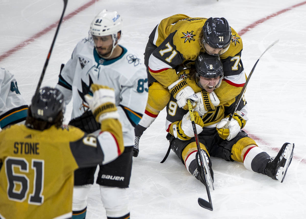 Golden Knights center Cody Glass (9) is hugged in celebration by center William Karlsson (71) a ...