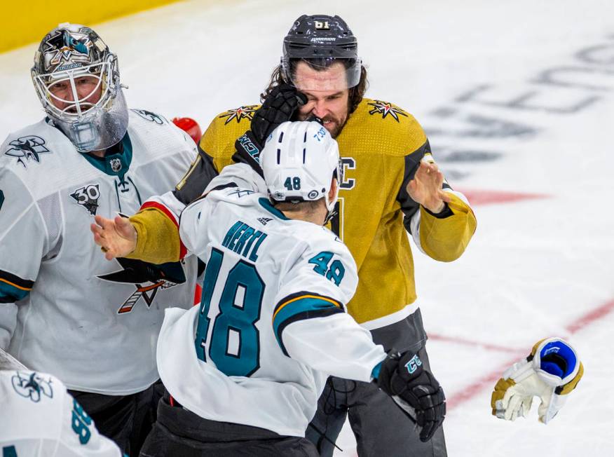 Golden Knights right wing Mark Stone (61) takes a punch to the eye from San Jose Sharks center ...