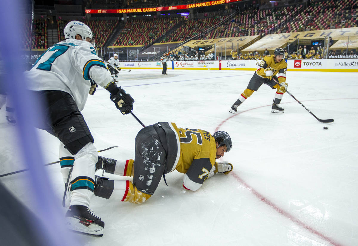 Golden Knights right wing Ryan Reaves (75) is down on the ice from a hit by San Jose Sharks cen ...