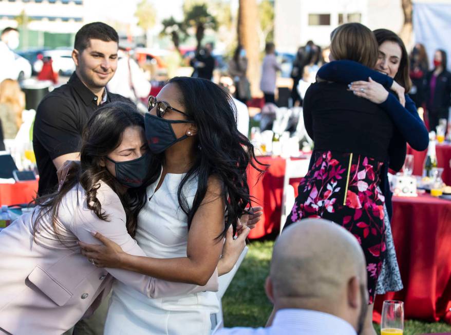 UNLV School of Medicine graduates Ginger Christian, left, and Lauren Hollifield react after ope ...