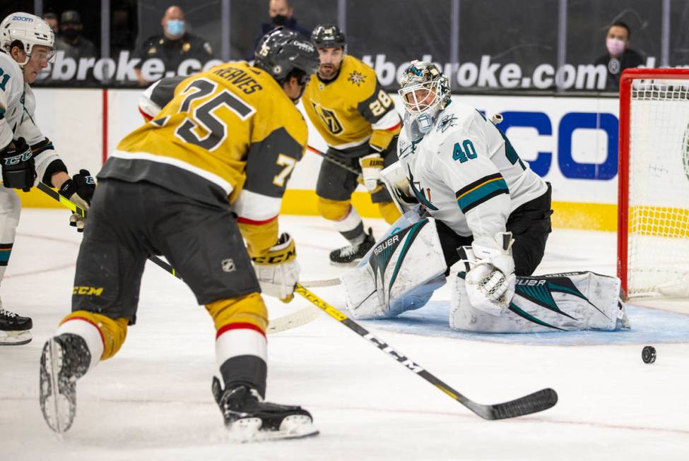 San Jose Sharks goaltender Devan Dubnyk (40) looks to s hot by Golden Knights right wing Ryan R ...