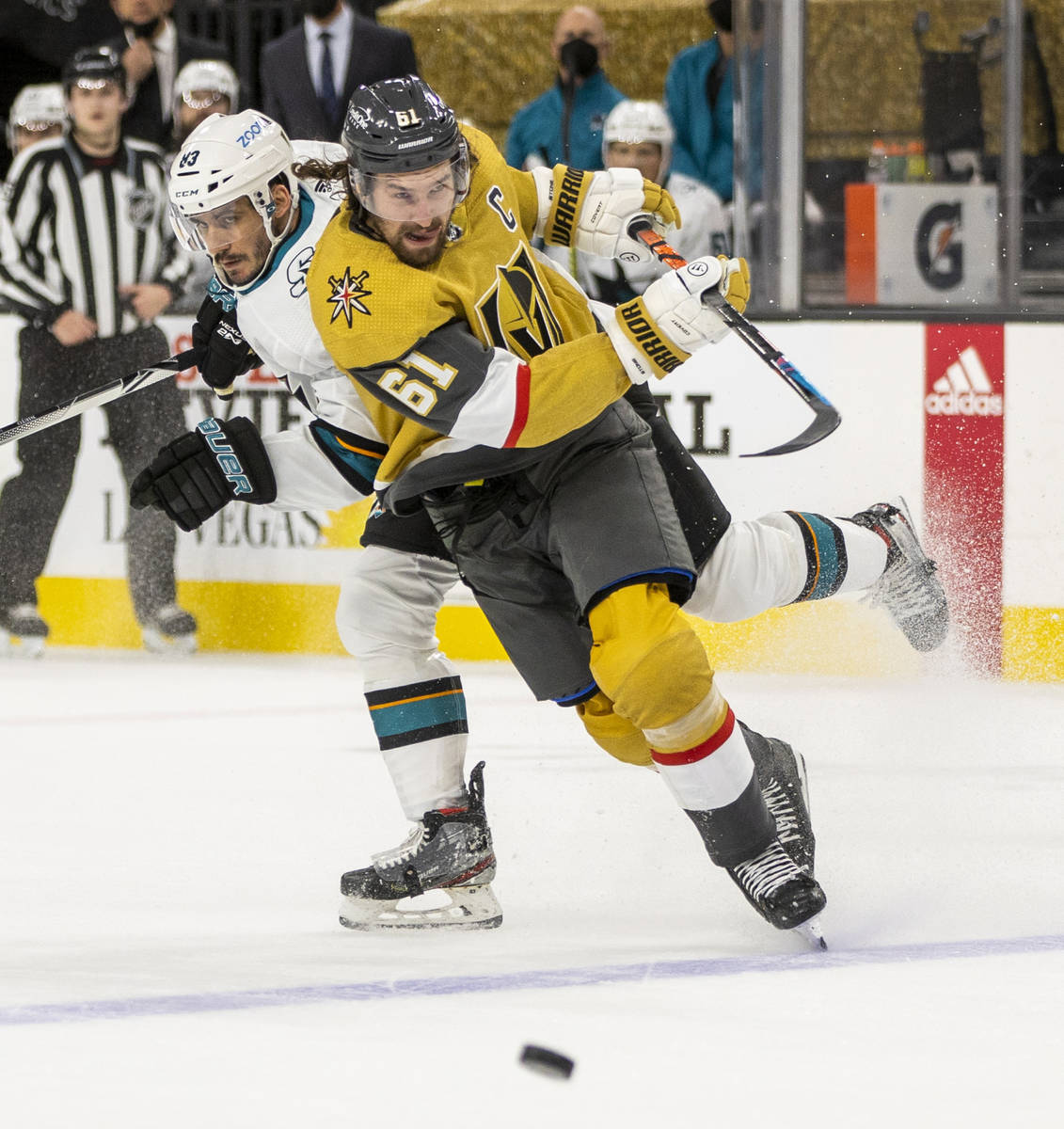 Golden Knights right wing Mark Stone (61) sends a shot to the goal over San Jose Sharks left wi ...