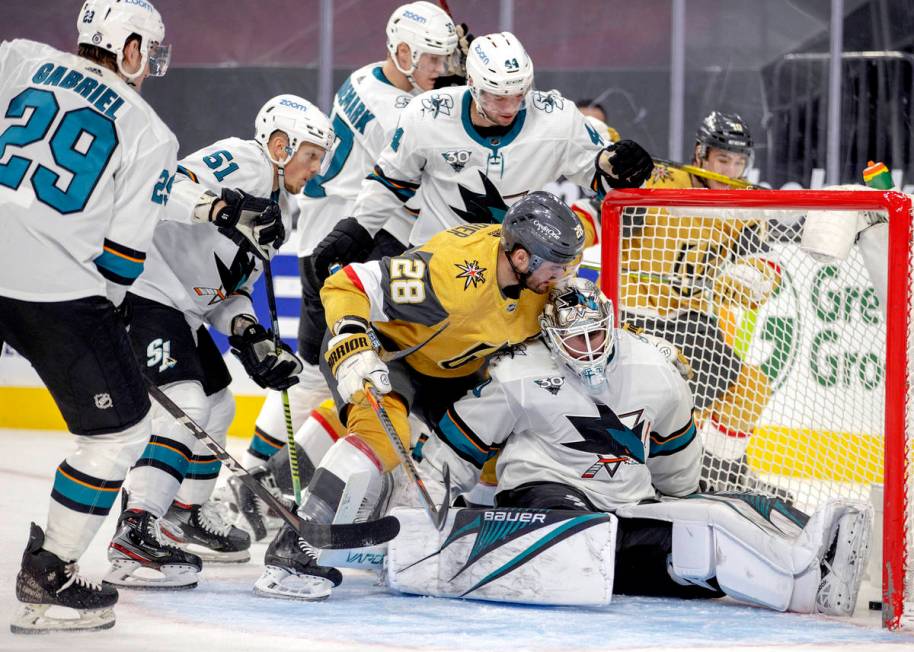 Golden Knights left wing William Carrier (28) gets over the top of San Jose Sharks goaltender D ...