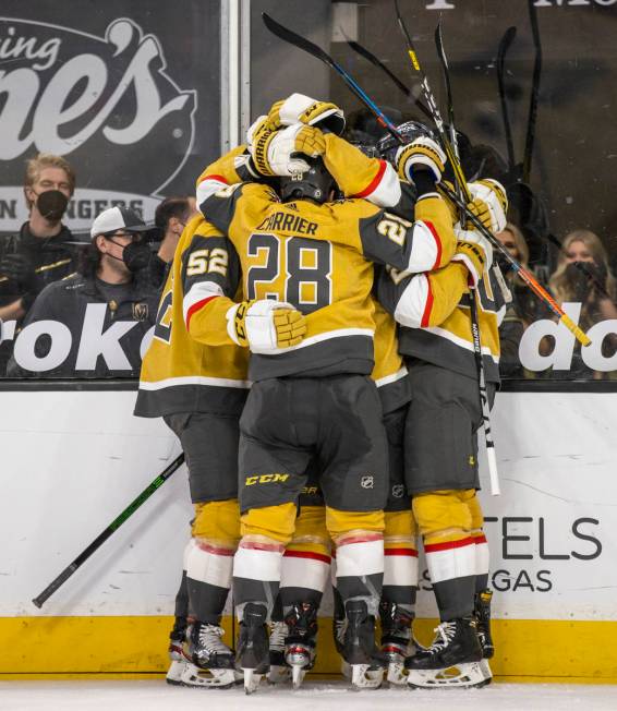 Golden Knights players celebrate a possible goal over San Jose Sharks goaltender Devan Dubnyk ( ...