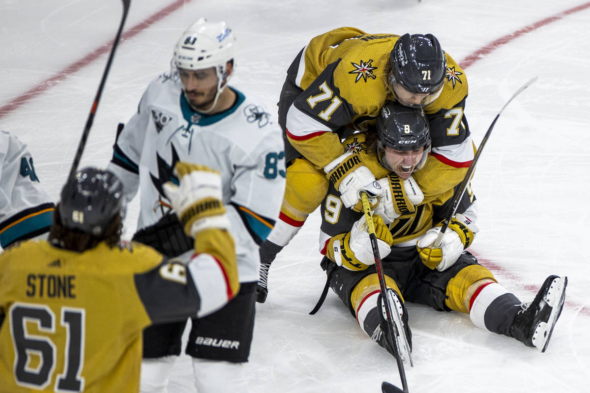 Golden Knights center Cody Glass (9) is hugged in celebration by center William Karlsson (71) a ...