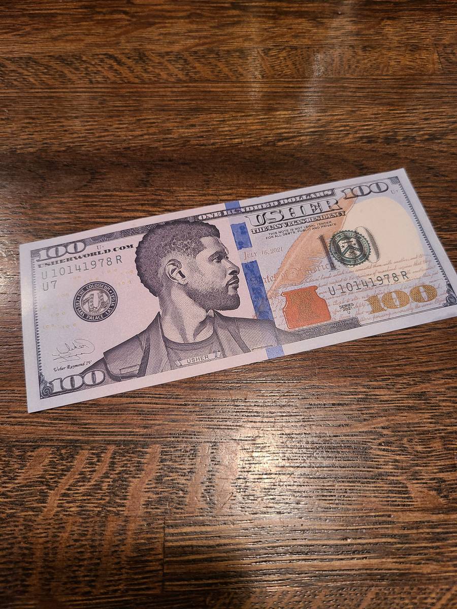Usher's commemorative $100 bill is shown at Esther's Kitchen in the Arts District on Tuesday, M ...