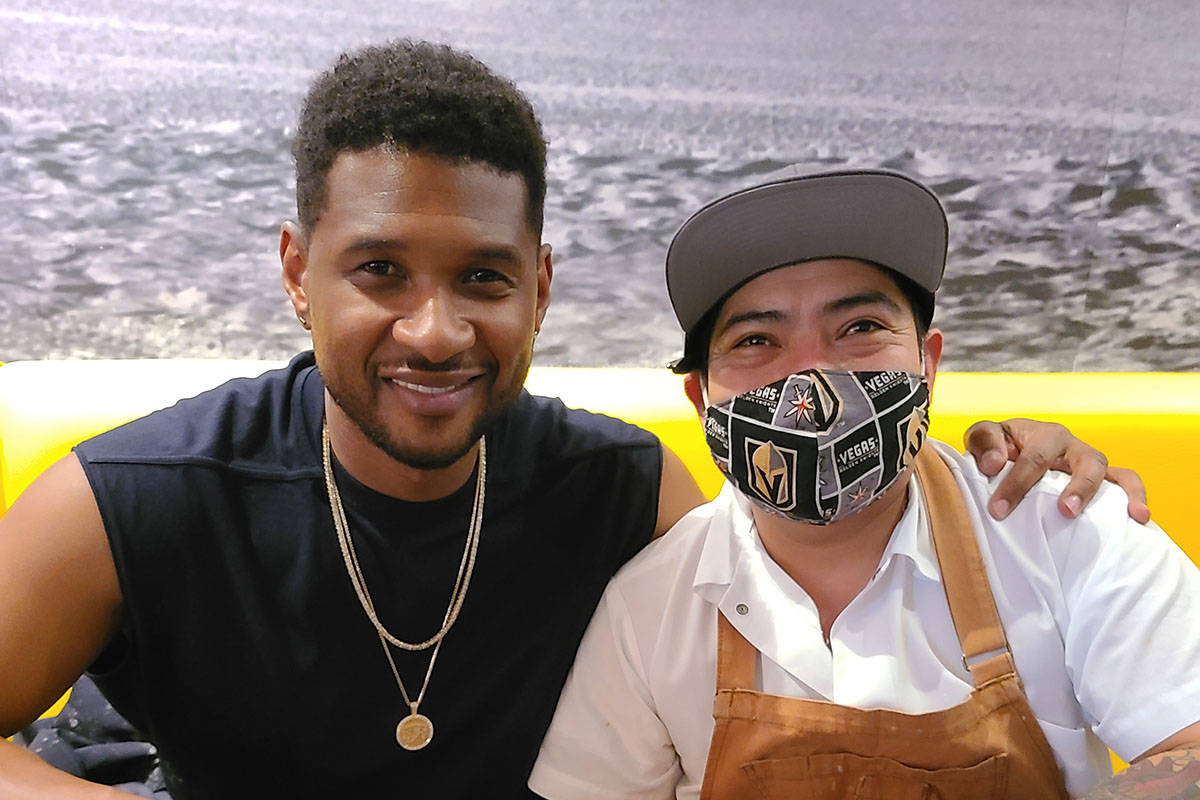 Usher is shown with Chef Pedro Vidal at Esther's Kitchen in the Arts District on Tuesday, March ...