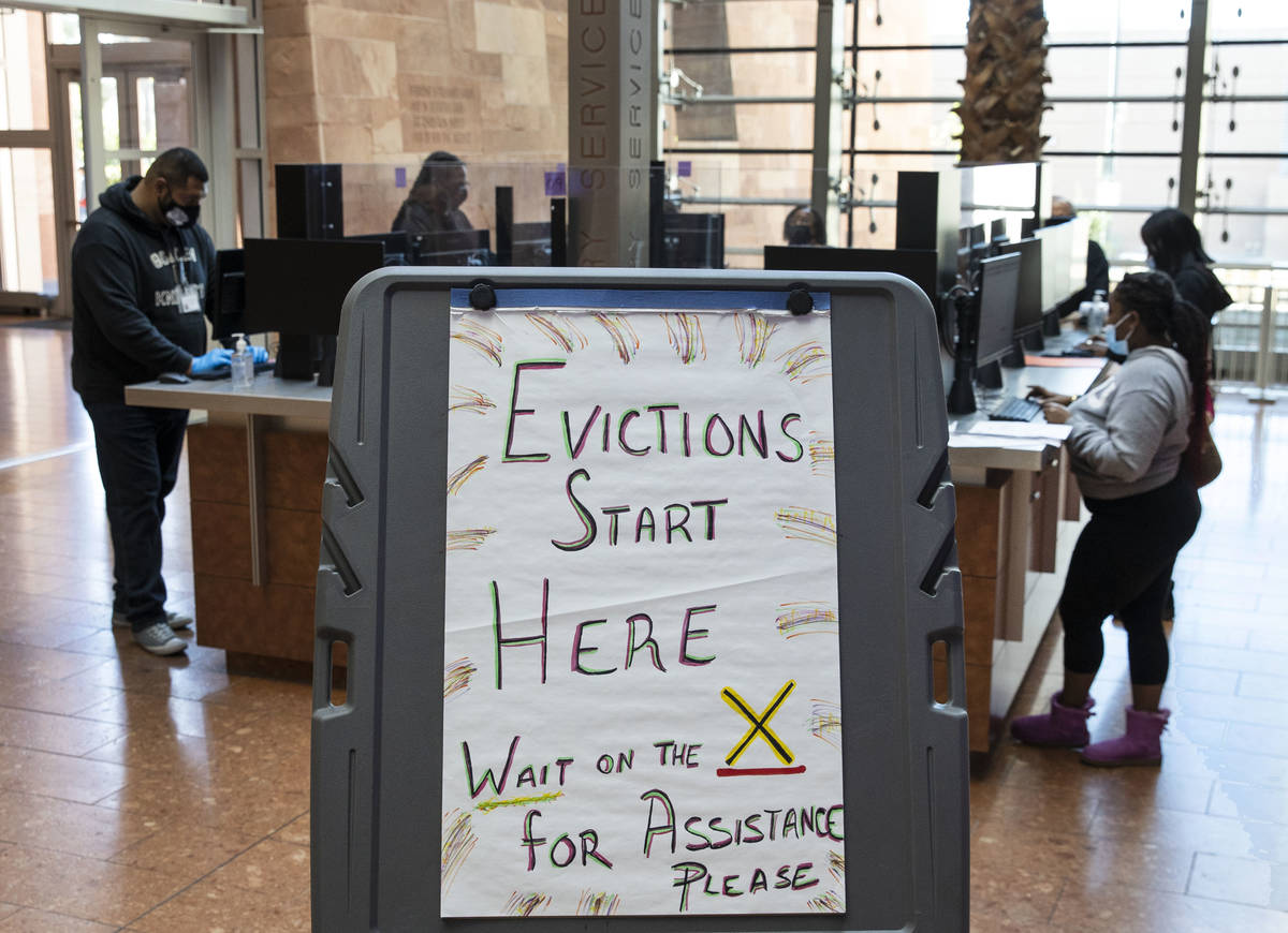 Tenants who received an eviction notice from their landlord fill out forms at the Civil Law Sel ...