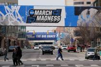 March Madness banners for the NCAA college basketball tournament cover crosswalks in downtown I ...