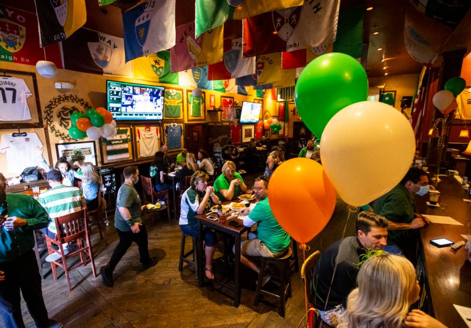 People gather to celebrate St. Patrick's Day at McMullan's Irish Pub in Las Vegas on Wednesday, ...