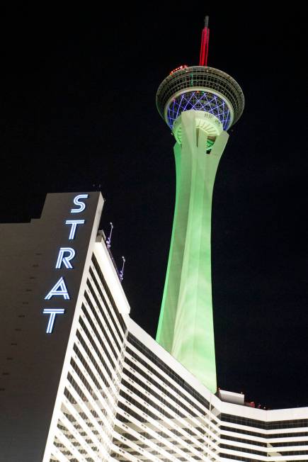 The STRAT is lit green for St. Patrick's Day on Wednesday, March 17, 2021, in Las Vegas. (Ellen ...