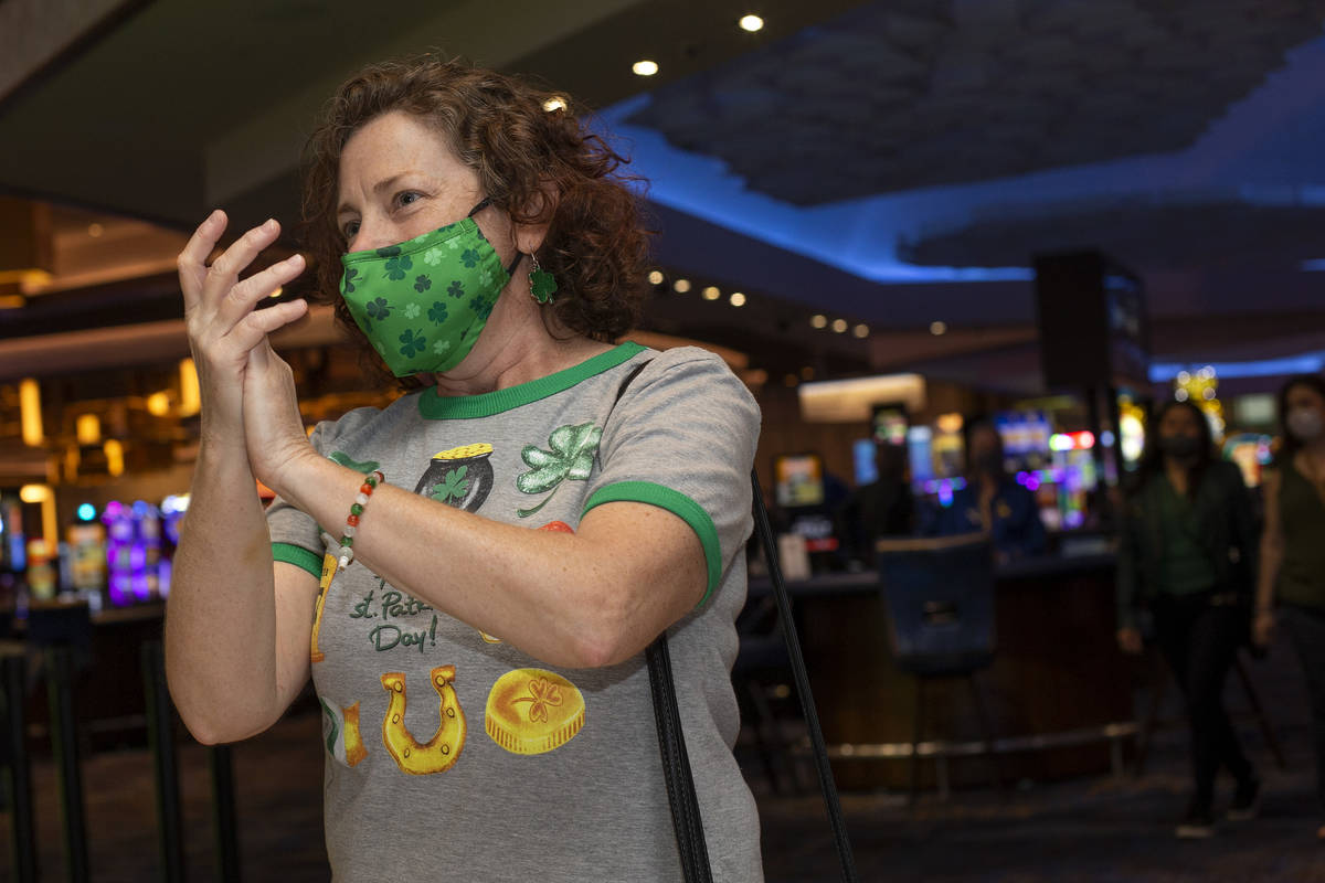 Las Vegan Vicki Toth claps along to The Celtic Rockers play a show on St. Patrick's Day at The ...
