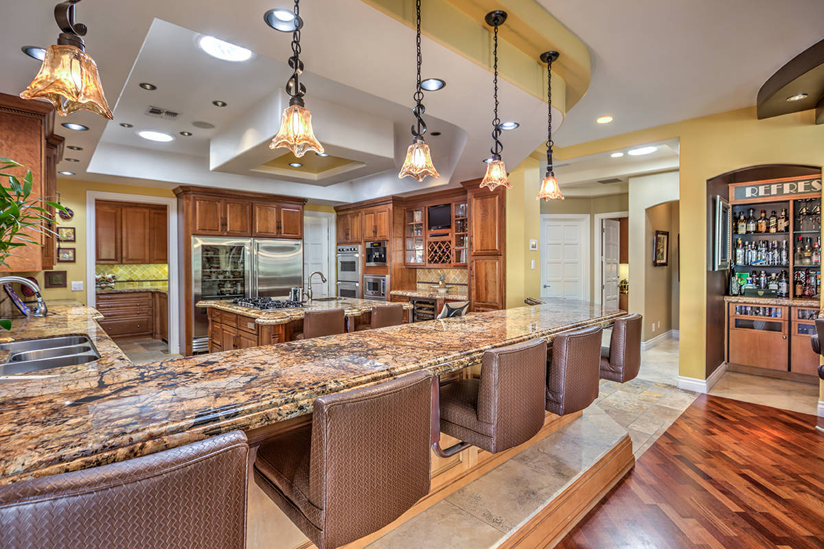 The kitchen has a large island with seating. (Mark Wiley Group)