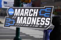 A March Madness sticker for the NCAA college basketball tournament is placed on a window in dow ...