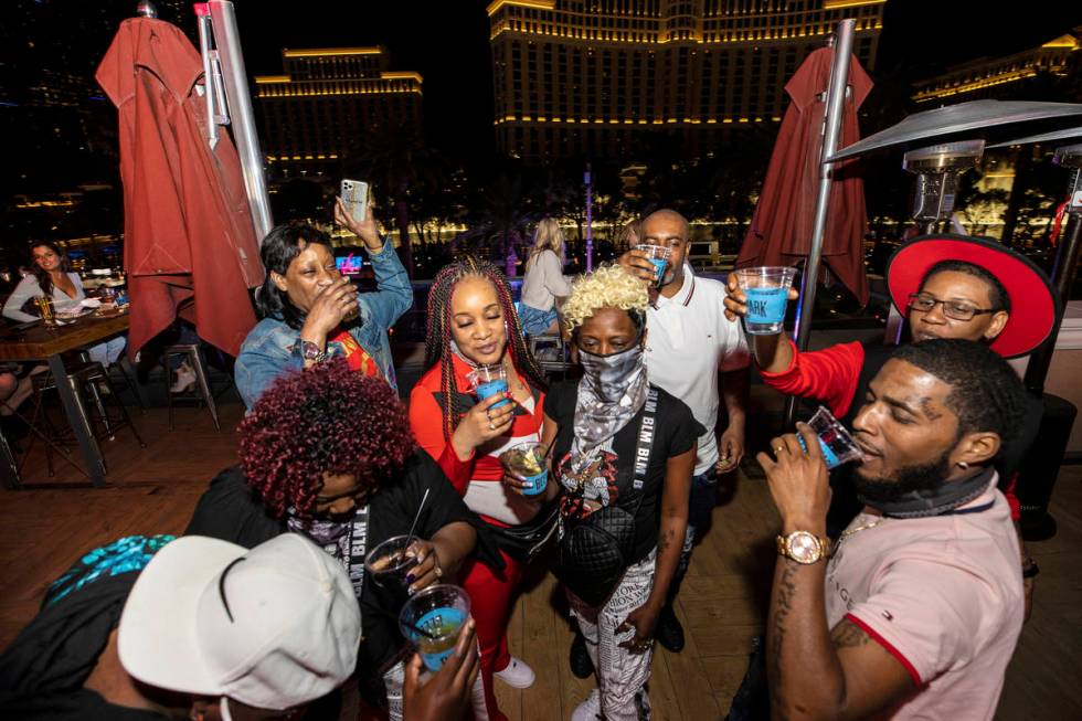 Guests celebrate with cocktails at Beer Park on Friday in Las Vegas. (Benjamin Hager/Las Vegas ...