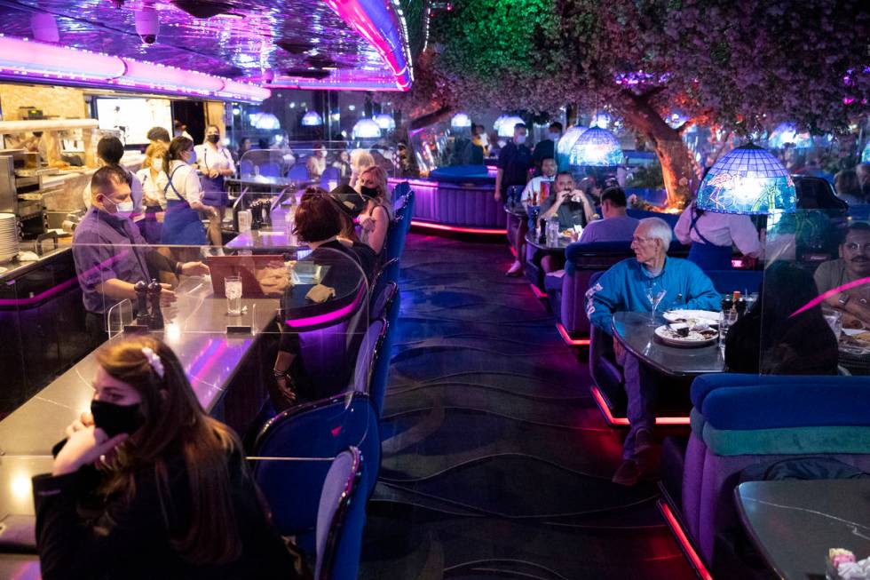 People dine at Peppermill Las Vegas restaurant in Las Vegas Friday night. (Erik Verduzco / Las ...
