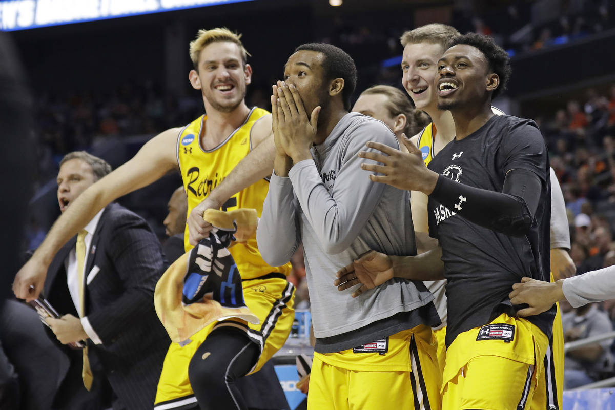 FILE - In this March 16, 2018, file photo, UMBC players celebrate a teammate's basket during th ...