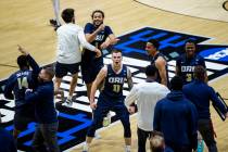 Oral Roberts players and coaches celebrate after beating Ohio State in a first-round game in th ...