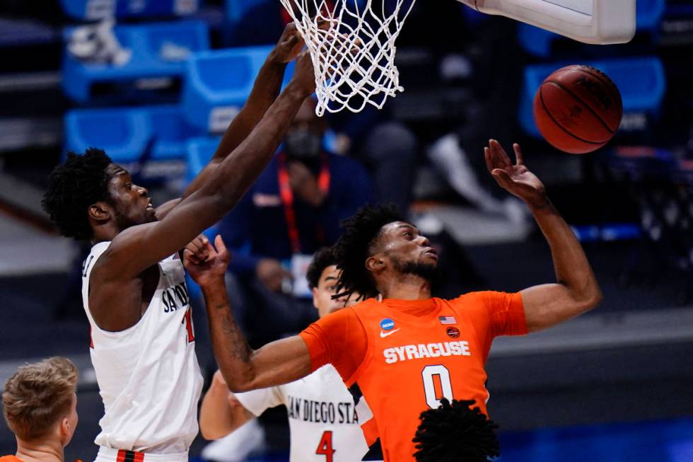 Syracuse forward Alan Griffin (0) tries to save a rebound in front of San Diego State forward N ...