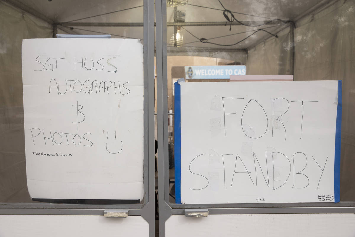 A Nevada National Guard operations tent at the Cashman Center in Las Vegas displays signs on th ...