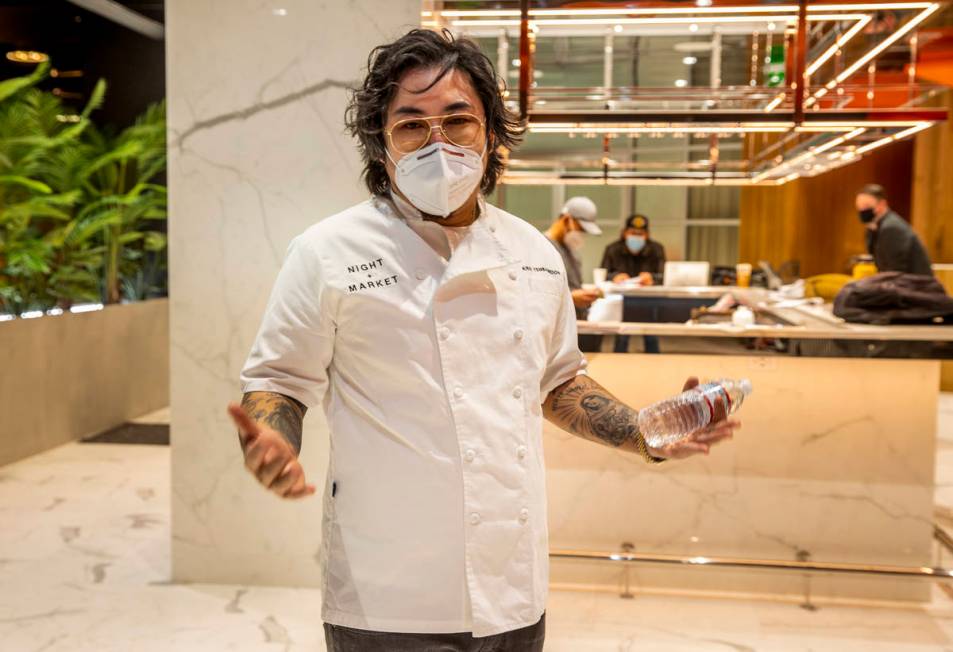 Chef Kris Yenbamroong discusses the concept of Night + Market while standing in the unfinished ...