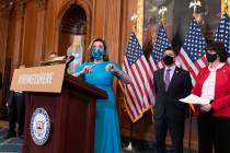 Speaker of the House Nancy Pelosi, D-Calif., joined at right by Rep. Raul Ruiz, D-Calif., chair ...