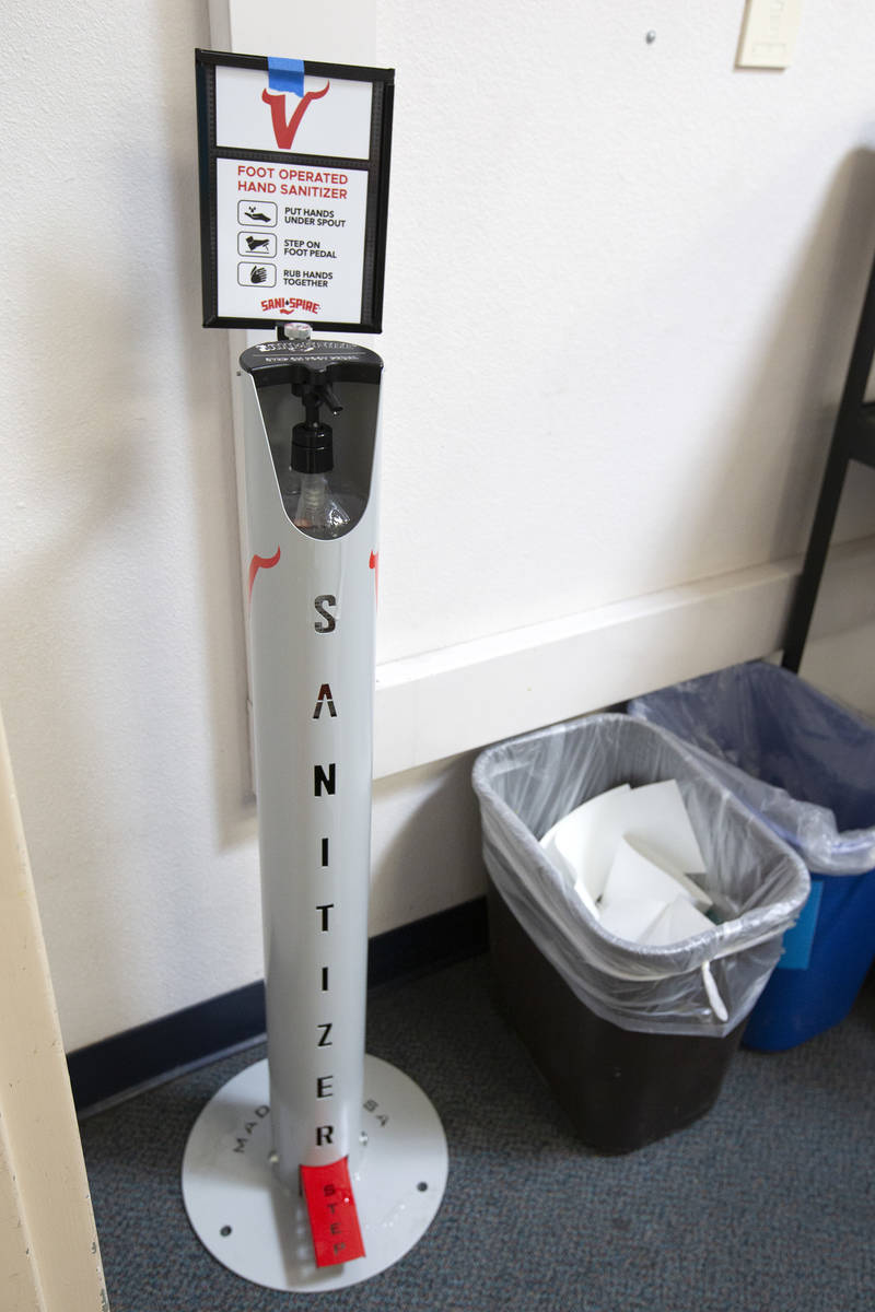 A foot-operated hand sanitizer is next to the doorway of a classroom at Valley High School on F ...